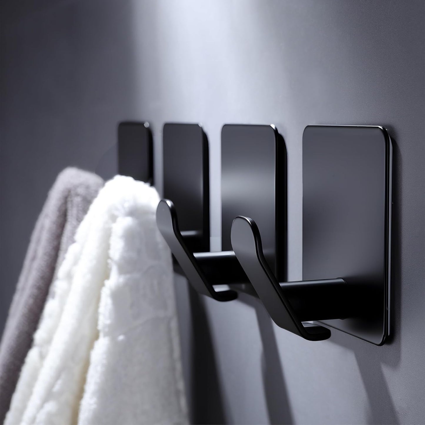 DELITON 4 Pack Adhesive Hooks - Towel Hook for Hanging Towels, Clothes and Bags, Matte Black Stainless Steel, Stick on Wall for Bathroom and Kitchen